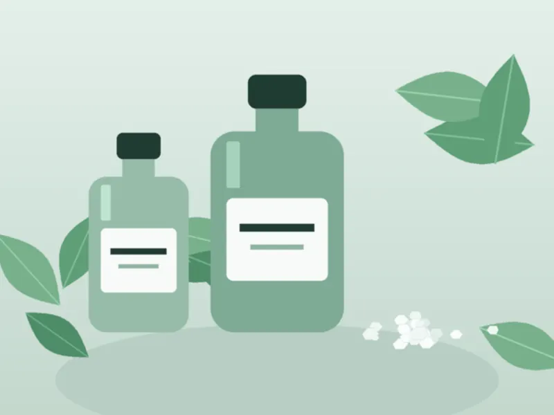 Scentedbud menthol oil bottles, fresh mint leaves, and menthol crystals on a mint stone surface